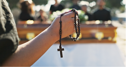 person holding rosary