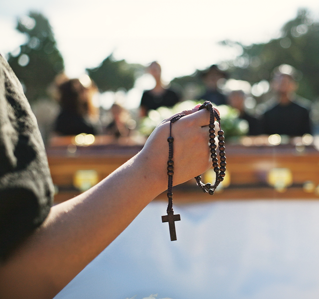 person holding a rosary