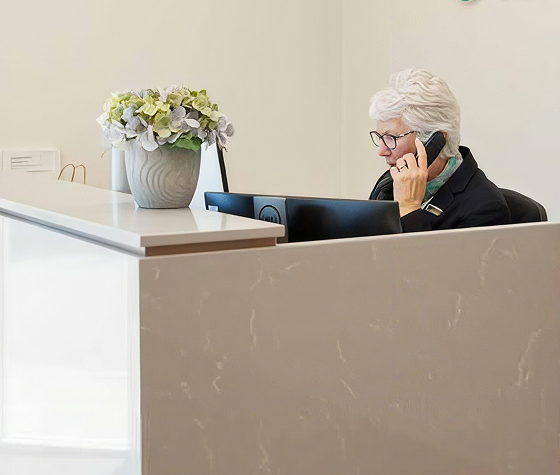 Christian funeral director arranging a funeral with a woman