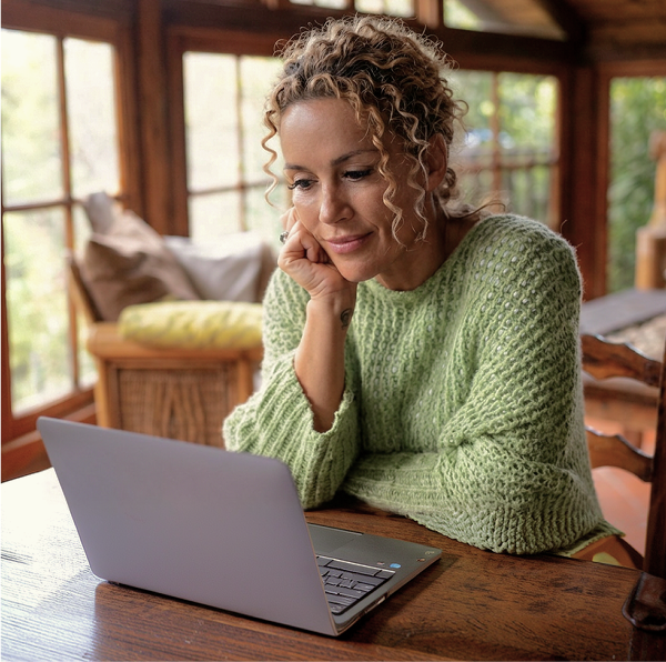 woman looking at laptop