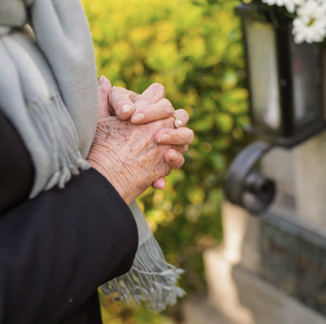 women holding her hands together