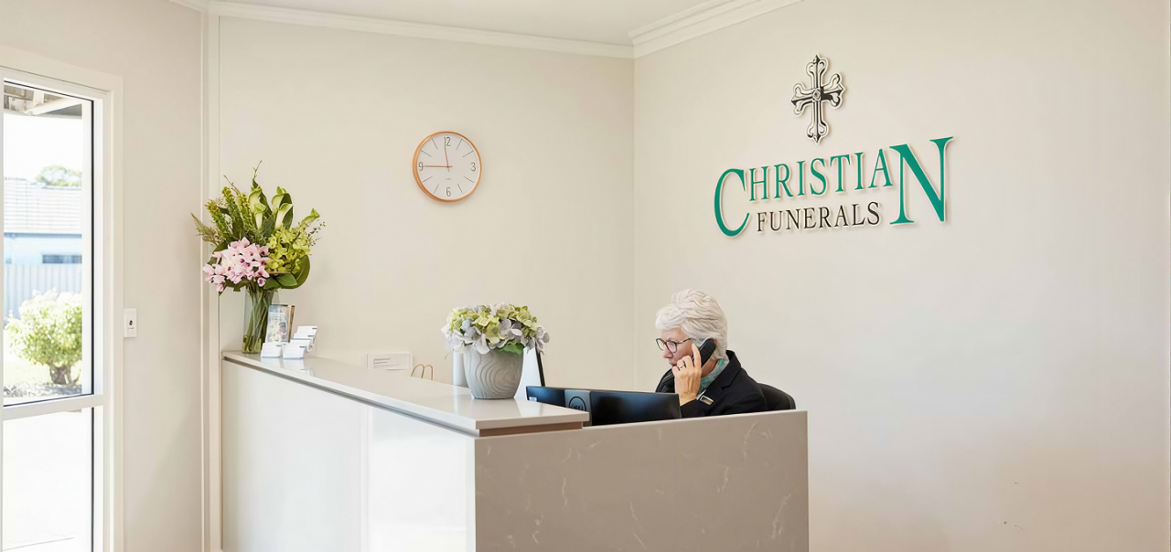 Christian funeral directors with woman
